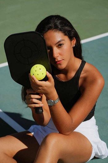 Woman with pickleball kit